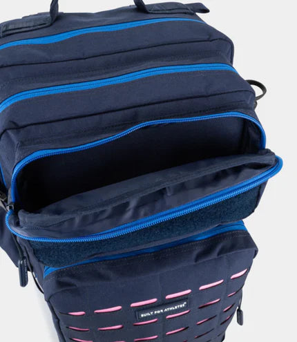 op down close-up view of the open compartments and blue zippers on the Built for Athletes Alpine F1 45L travel backpack showing smart interior organization