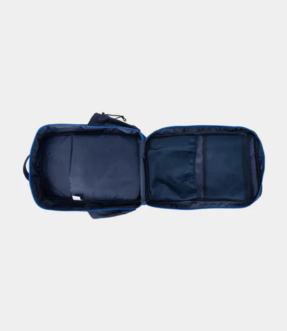 Open navy blue travel bag on a light gray background
