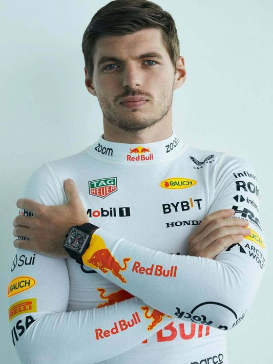 Person wearing a white racing suit with various sponsor logos on a light gray background