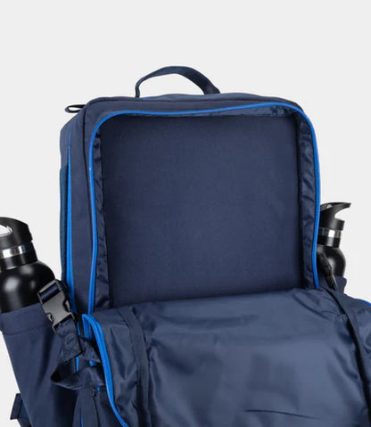 Navy blue backpack with blue interior on a light gray background