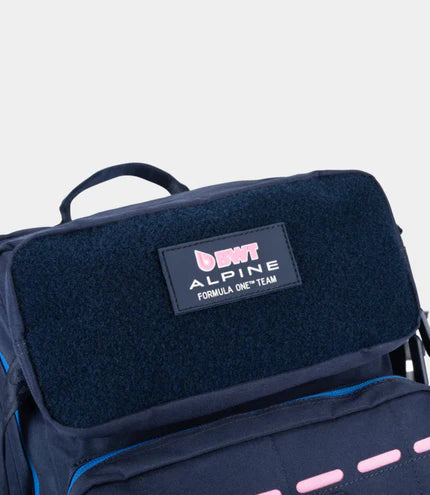 Navy blue bag with a pink and white logo on a light gray background