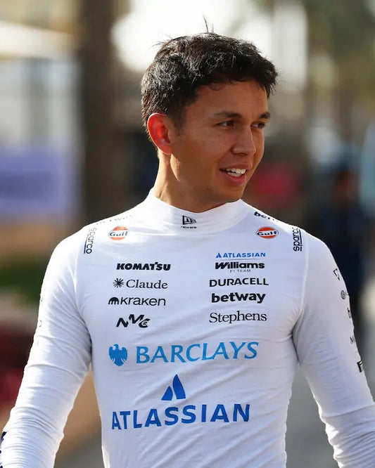 Front view of the Alex Albon 2026 Williams F1 Team white compression shirt, featuring the blue Komatsu sleeve panels and Atlassian logo, worn as a driver-spec base layer.