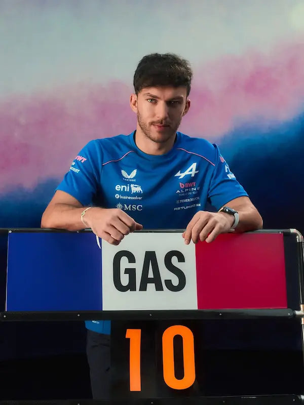Person holding a sign with 'GAS' and number '10' against a colorful background