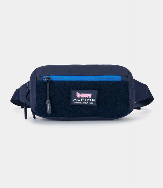 Straight front view of the navy blue Built for Athletes BWT Alpine F1 Team crossbody bag showing the front zip, Velcro panel, and team patch.