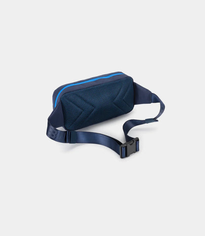 Back angle view of the Built for Athletes Alpine F1 crossbody bag highlighting the ergonomic padded mesh back panel, adjustable webbed strap, and heavy-duty buckle.