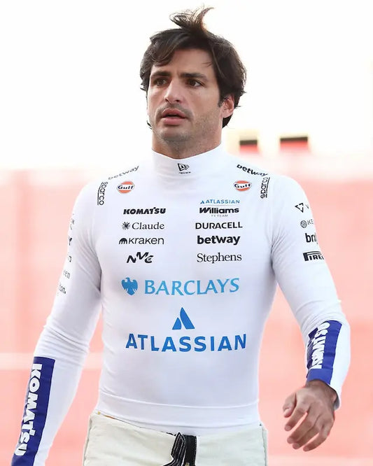 Front-facing view of the 2026 Williams F1 Carlos Sainz Driver Edition compression shirt in white, displaying the Atlassian, Barclays, and Gulf logos with signature blue sleeve panels.
