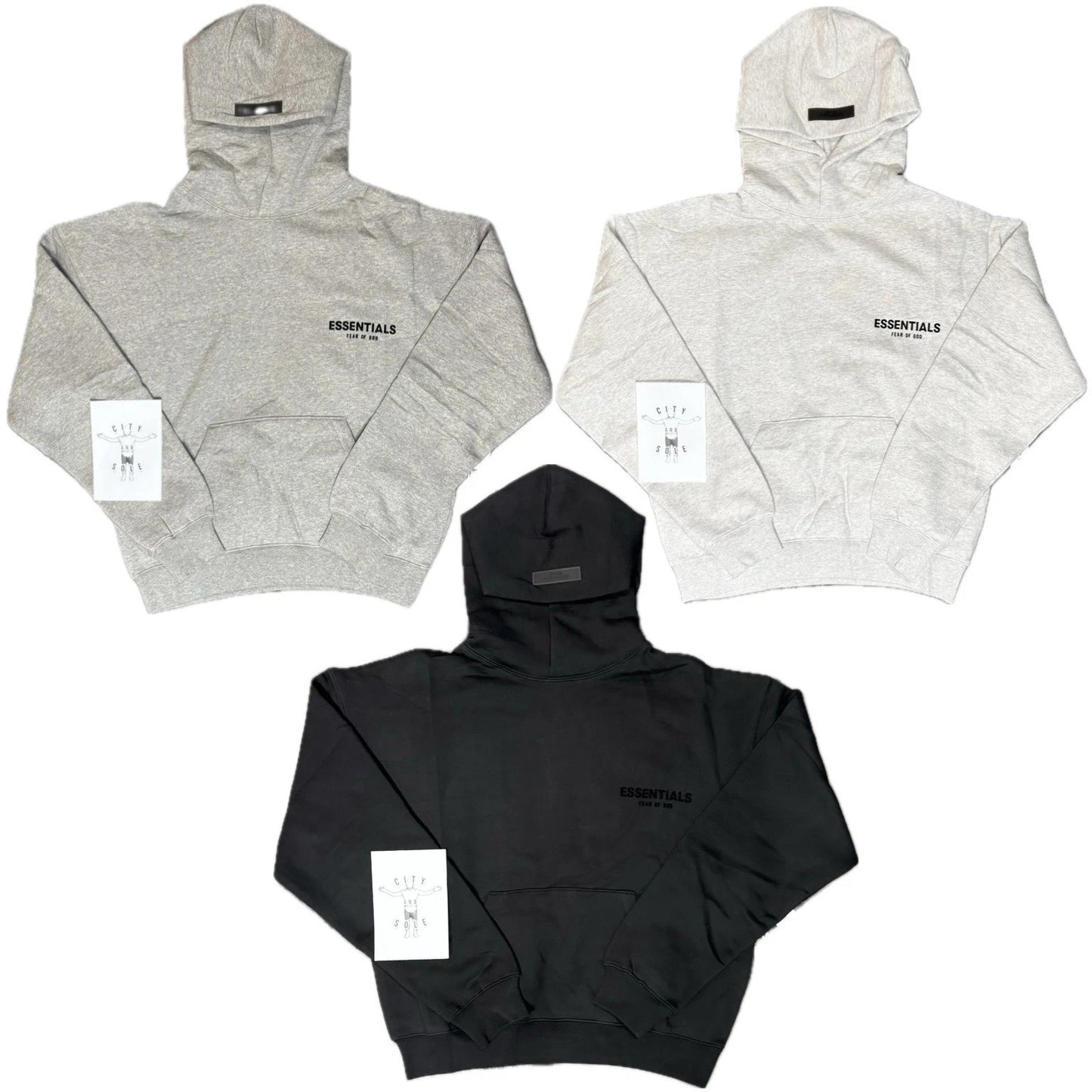 Three hoodies in gray, black, and white with 'ESSENTIALS' branding on a white background.