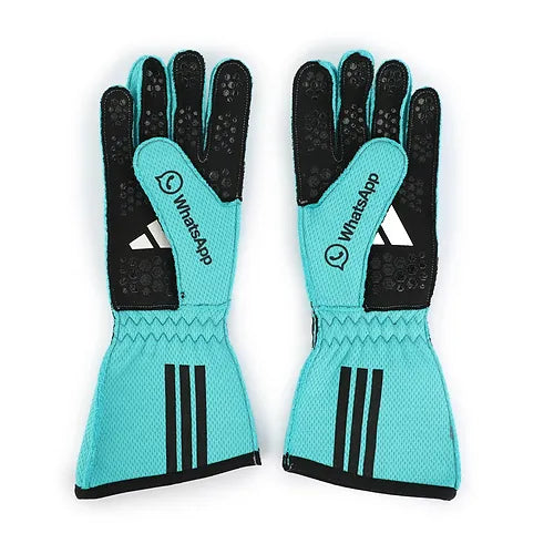Pair of teal gloves with black accents featuring WhatsApp and Adidas logos on a white background