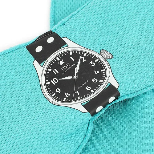 Watch with black strap on a turquoise background
