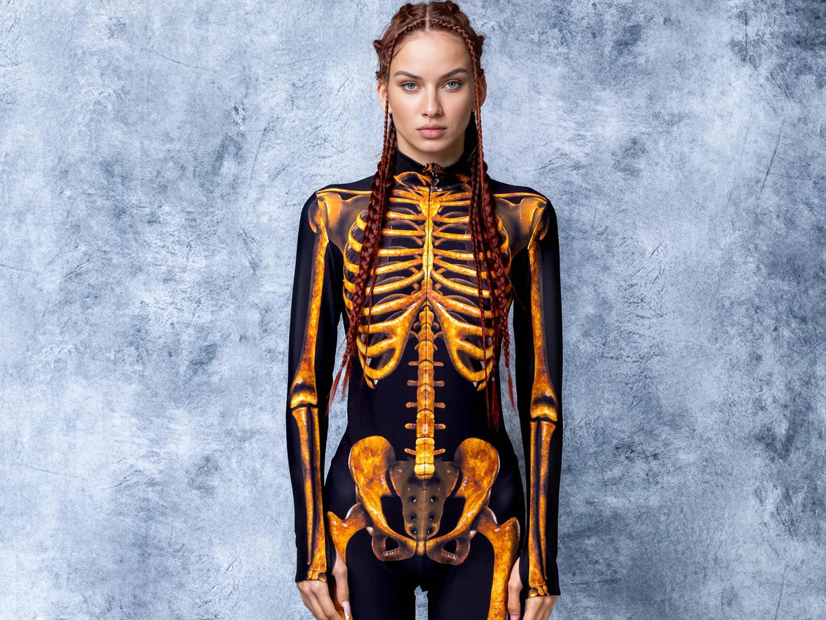 Close-up detail of high-definition sublimated gold skeleton bone graphics and hidden front zipper on Lycra suit