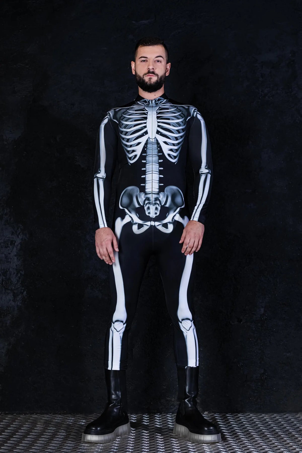 Men's skeleton bodysuit styled alongside matching women's costume for Halloween couple outfits