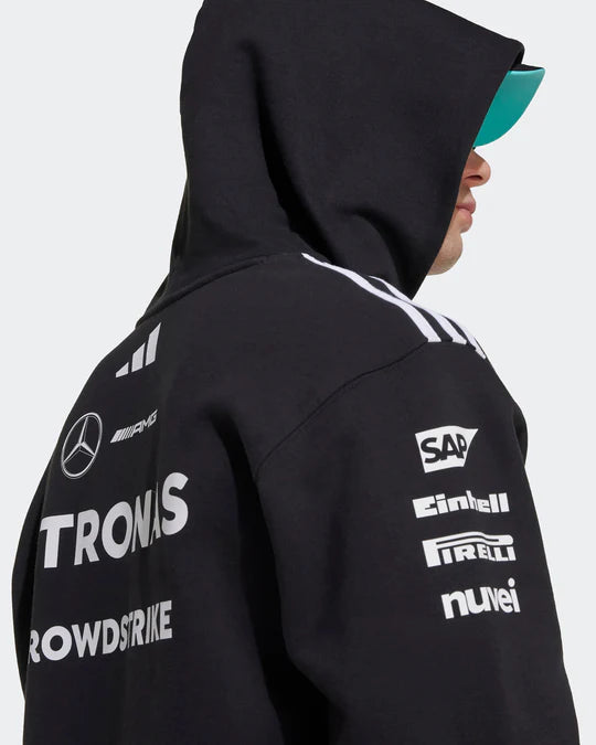 Men wearing official Mercedes F1 Team 2025 black hoodie - premium motorsport apparel