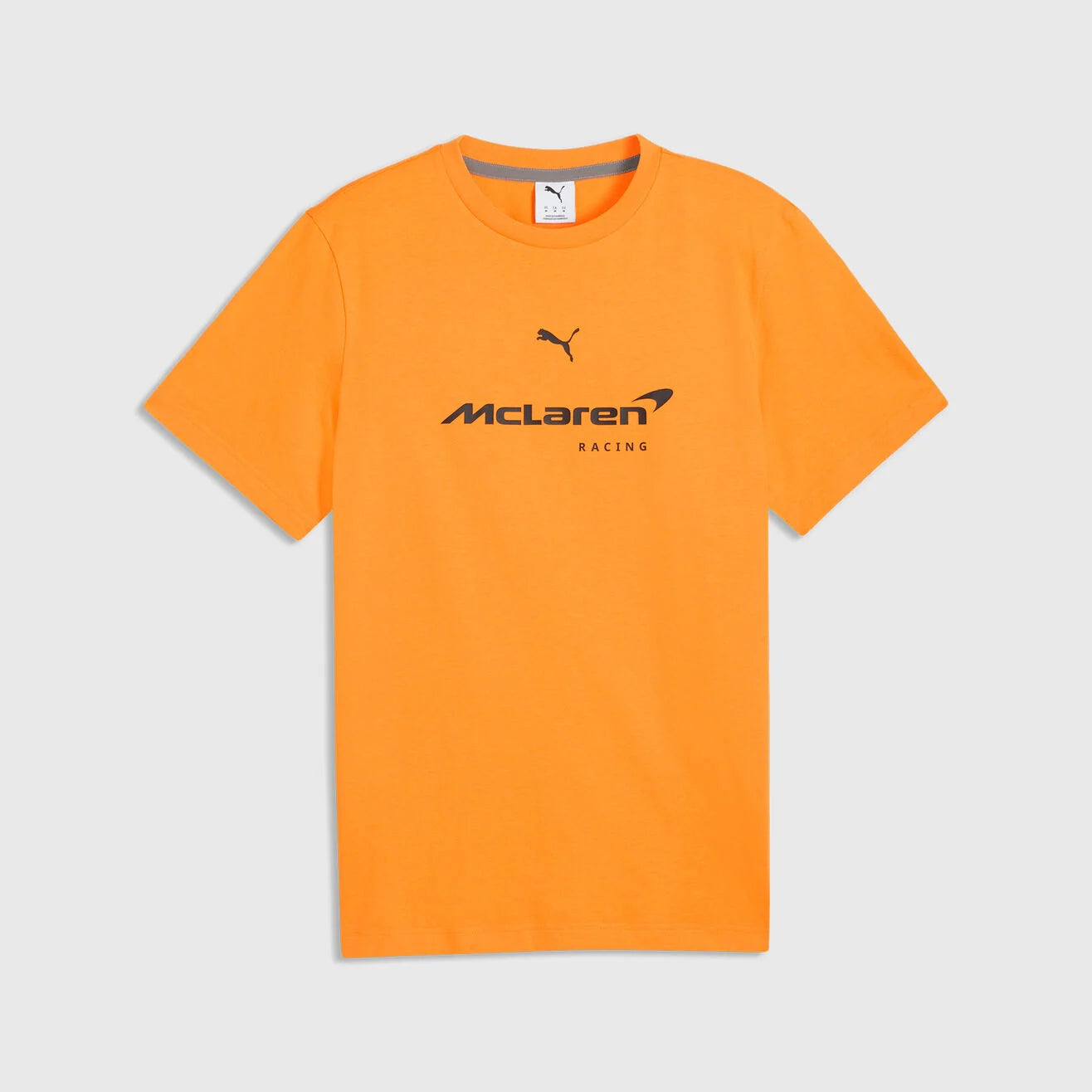 Front view of the black McLaren Racing inspired unisex t-shirt featuring a large high-definition orange speedmark logo printed on the chest by TassFit Performance