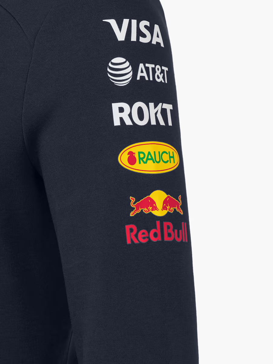 F1 fan wearing official Red Bull Racing replica hoodie - championship team apparel
