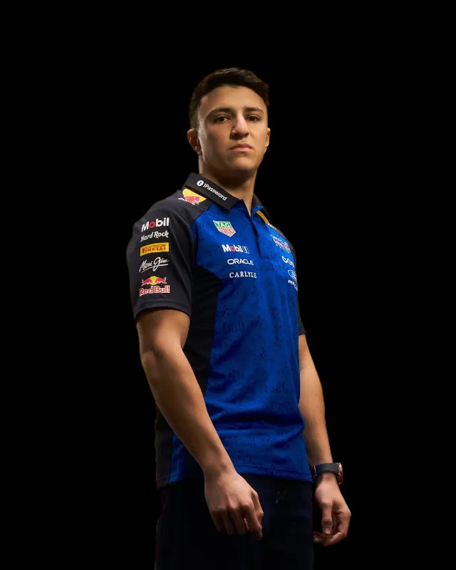 Side view displaying the polo's fit and sleeve with additional partner logos (Visa, ROKO, Hard Rock).